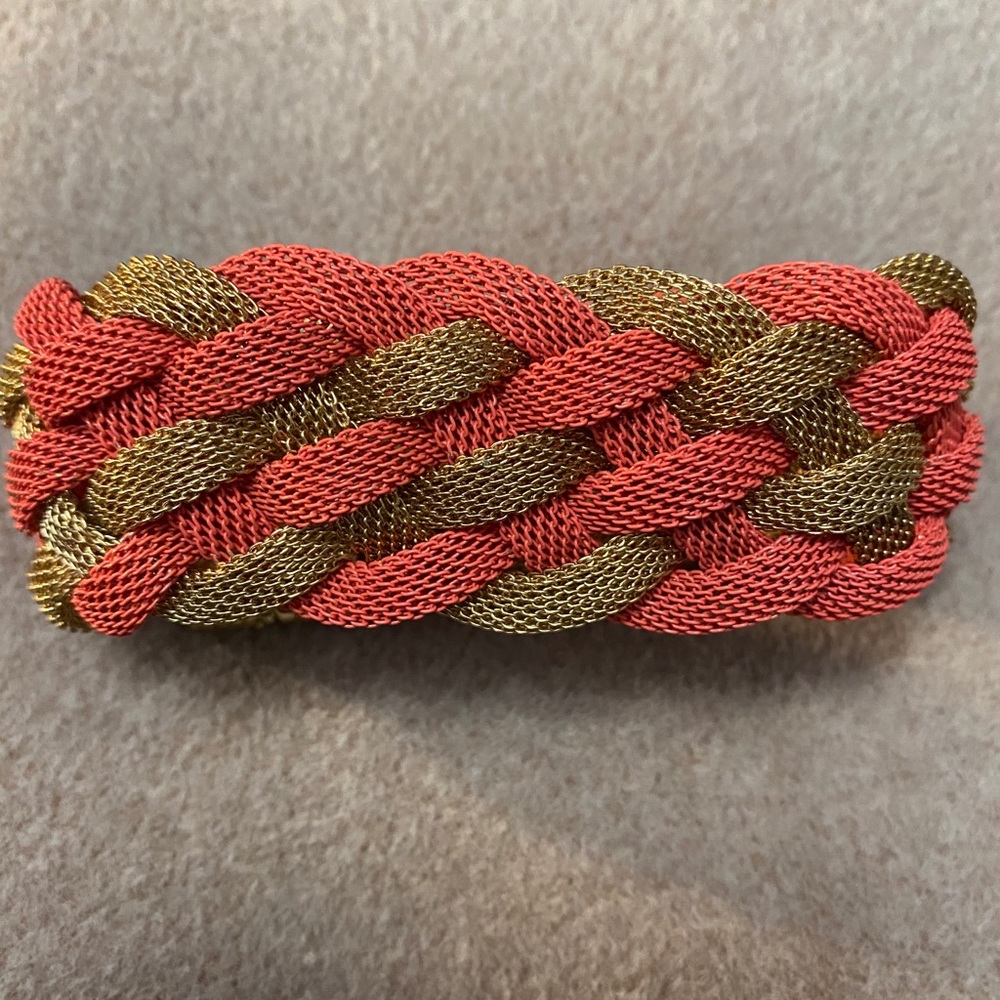 Gold and coral woven bracelet.